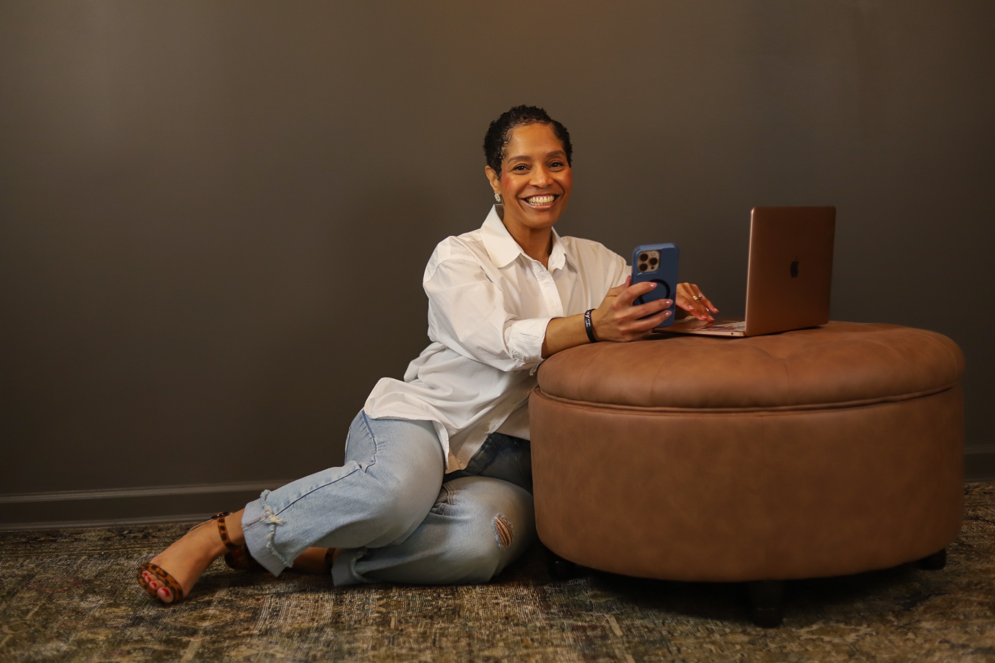 Dari Crawford smiling at her laptop